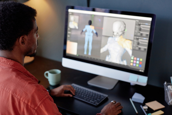 person working on computer creating 3D model with digital tools and software